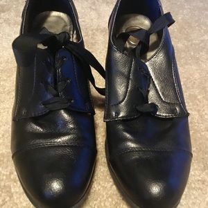 Black faux leather heeled tie shoes